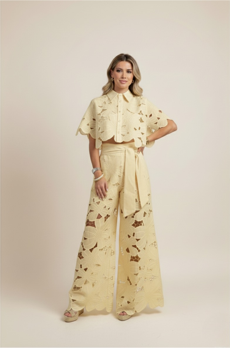Woman walking in a comfortable floral embroidered two-piece wide-leg set, epitomizing casual elegance.