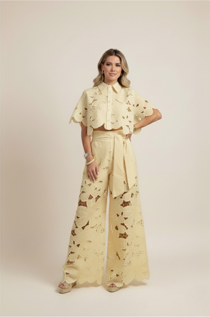 Woman walking in a comfortable floral embroidered two-piece wide-leg set, epitomizing casual elegance.