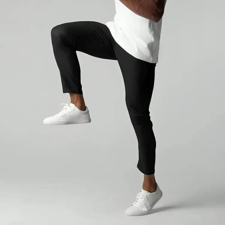 Close-up of men's tapered ankle length chinos. Flat front smart casual pants suitable for work or leisure.