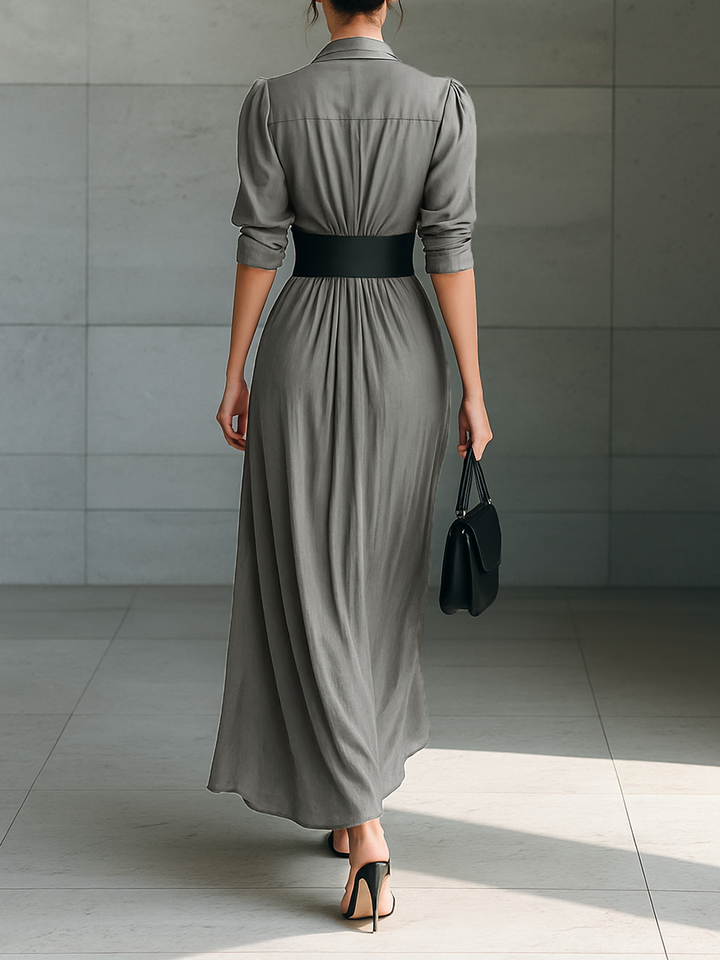 Chic women's grey pleated long dress, a versatile and sophisticated piece for autumn fashion or special occasions.