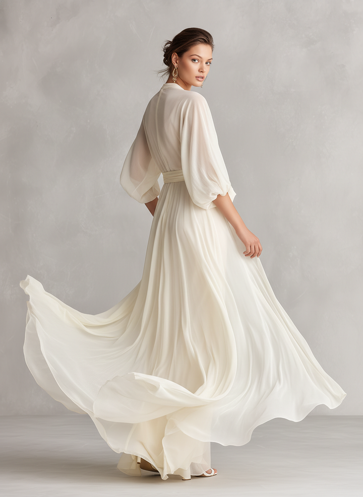 Ivory sheer wrap maxi dress for women, featuring elegant puff sleeves. A romantic and sophisticated special occasion dress.
