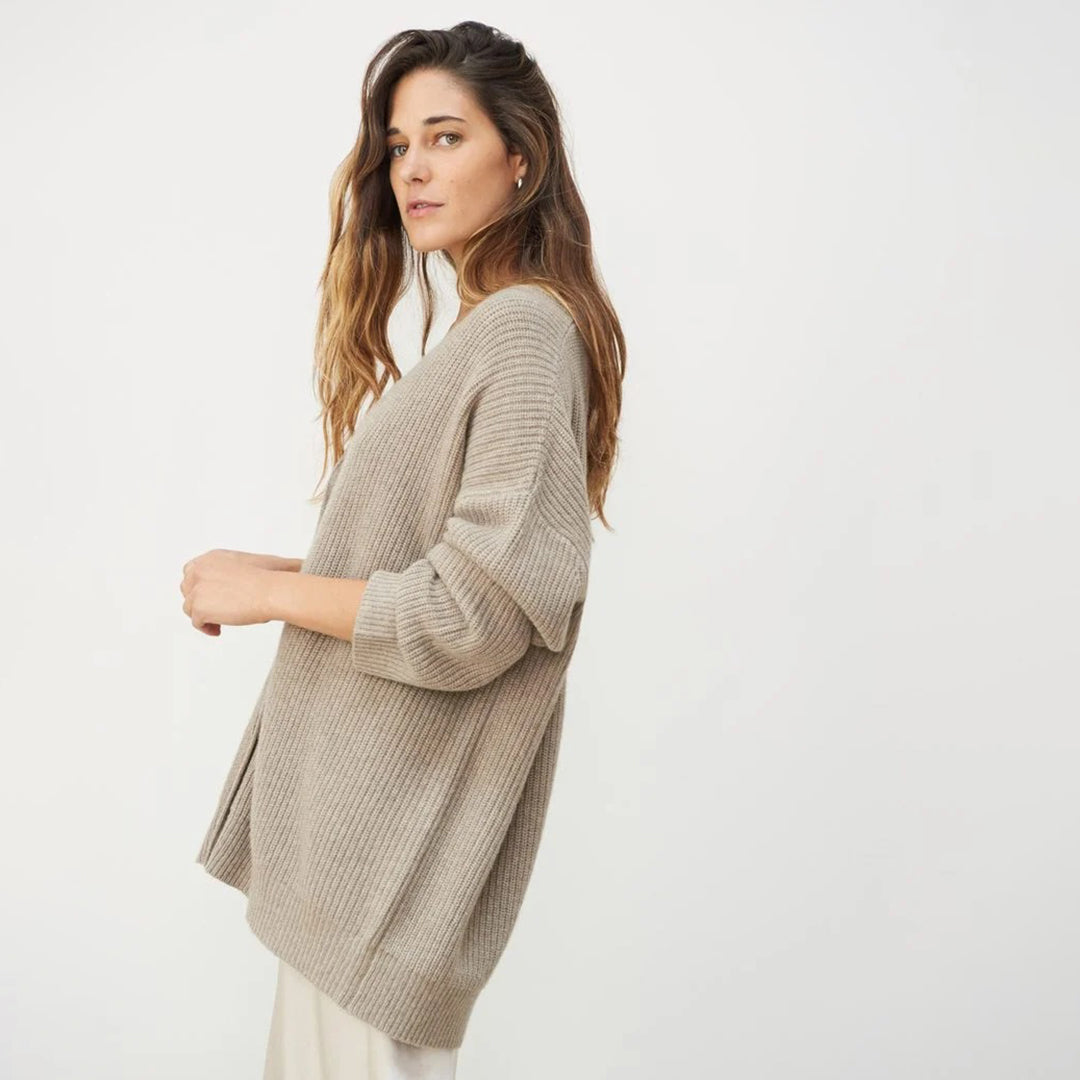 Casual women's long oversized ribbed cardigan, an open front design for stylish layering.