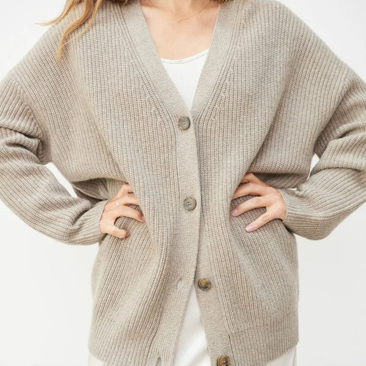 Elegant women's long oversized rib-knit cardigan, offering cozy comfort and chic style.