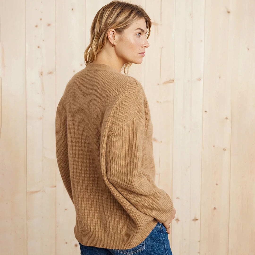 Plus size women's long oversized rib-knit cardigan, versatile for layering and modern comfort.