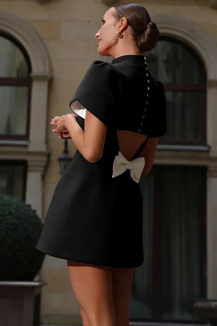 Spring fashion essential: elegant women's mini dress with a chic back bow, perfect for versatile styling.