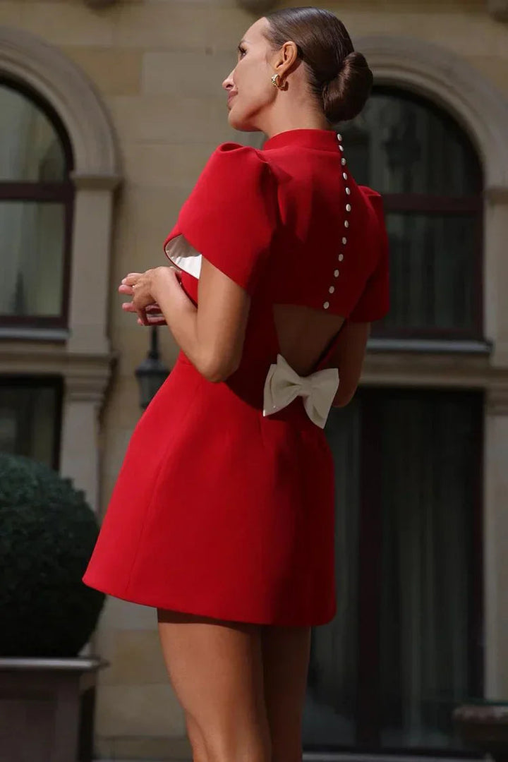 Casual yet elegant women's mini dress, sleeveless with a chic back bow, ideal for spring fashion.