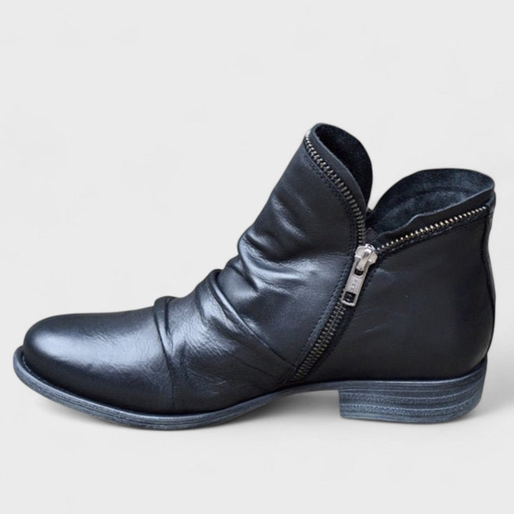 Elegant women's orthopedic ankle boots, supportive & comfortable. Fashionable winter footwear for daily wear.