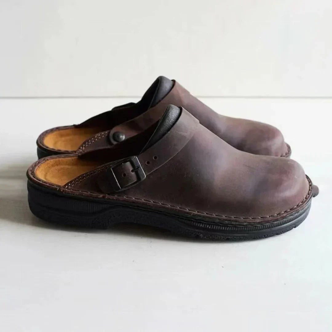 Comfortable men's slip-on clogs with buckle detail, perfect everyday casual shoes for men's relaxed style.