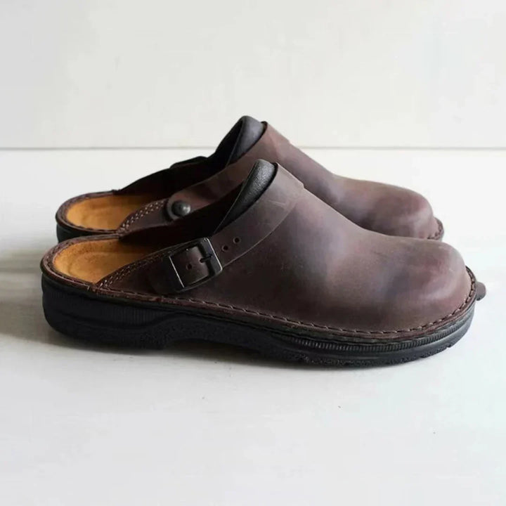 Comfortable men's slip-on clogs with buckle detail, perfect everyday casual shoes for men's relaxed style.