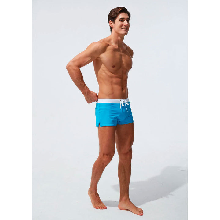 Vibrant red men's swim trunks with comfort fit elastic waist, perfect quick-dry pool wear.