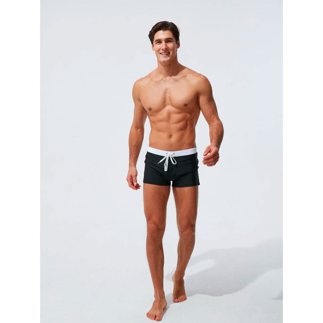 Men's quick-dry swim shorts, elastic comfort waistband, perfect for active beach days.