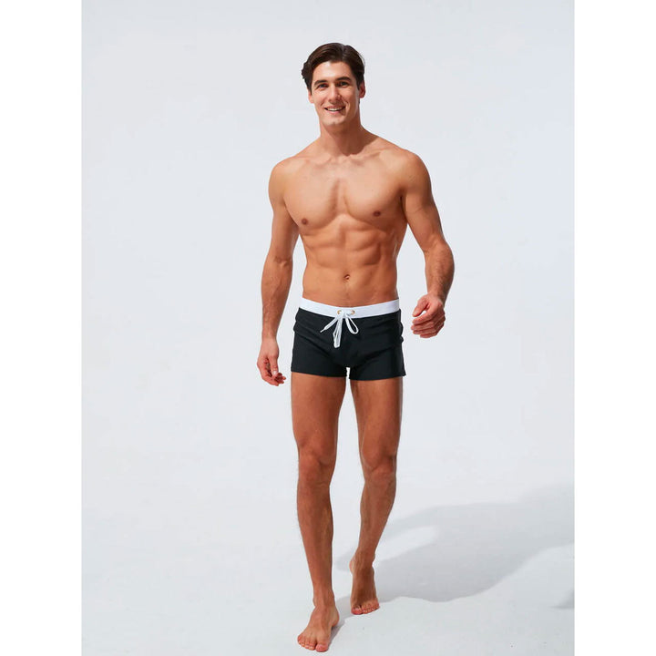 Men's quick-dry swim shorts, elastic comfort waistband, perfect for active beach days.