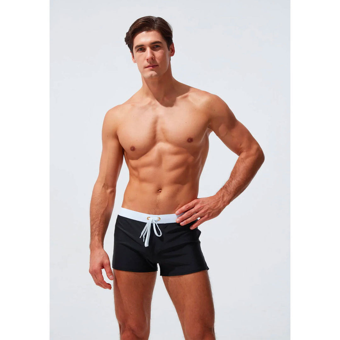 Geometric pattern men's swim shorts, quick-dry, comfort waistband, stylish for beach.