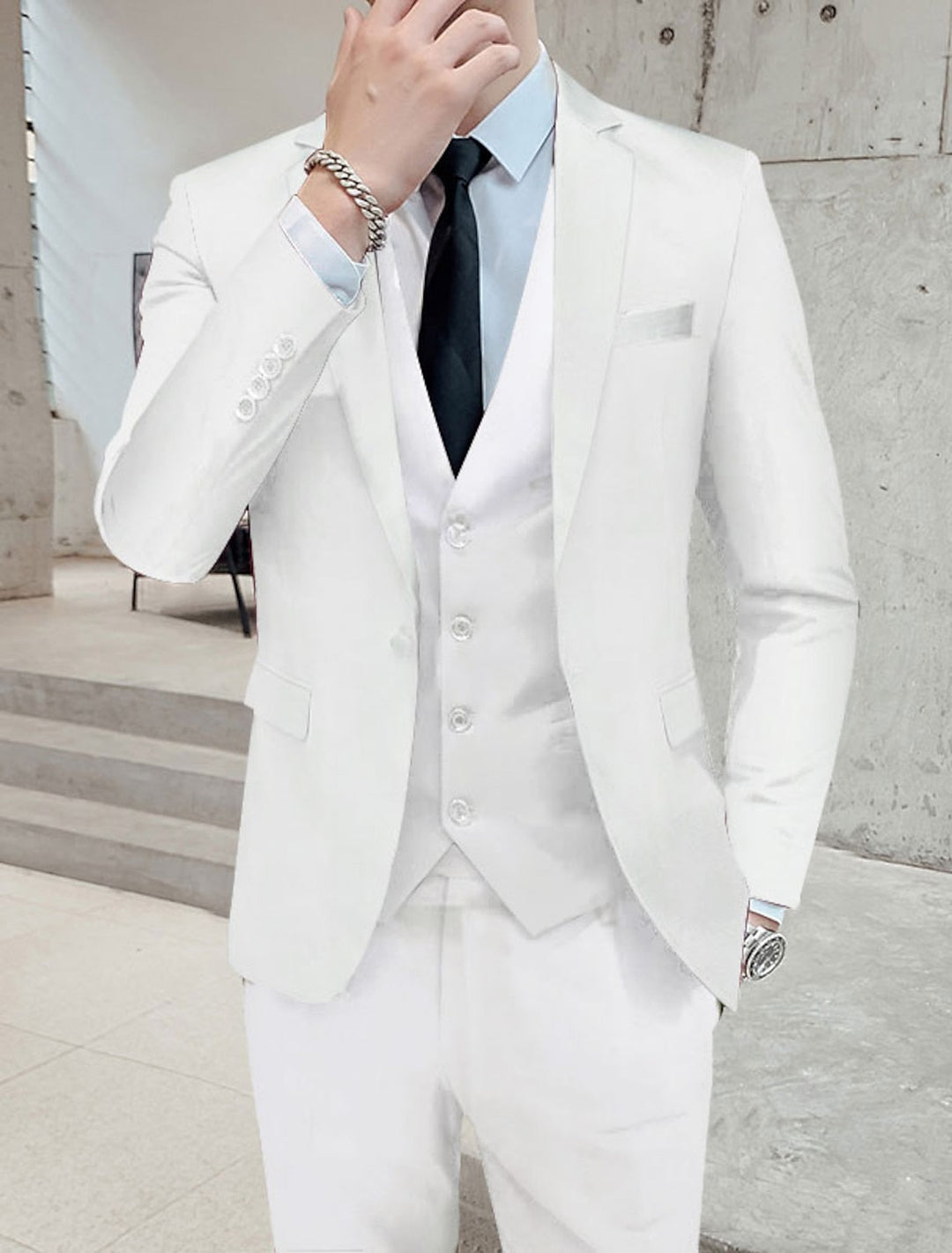 Sophisticated men's classic single-breasted 3-piece suit. Complete formal wear outfit for any elegant occasion.