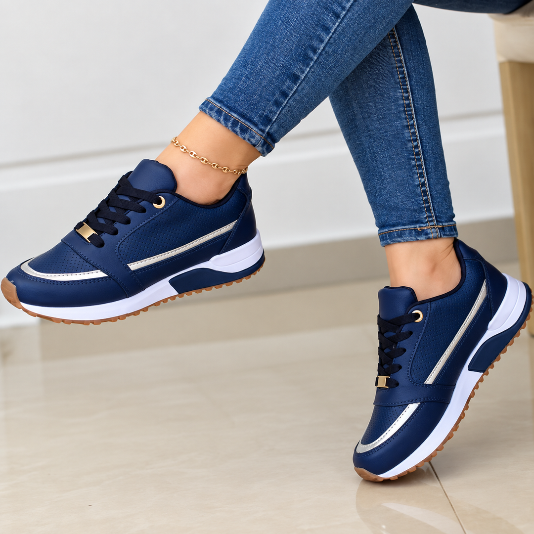 Women's black lace-up comfort sneakers with stylish metallic accents and a trendy platform sole.