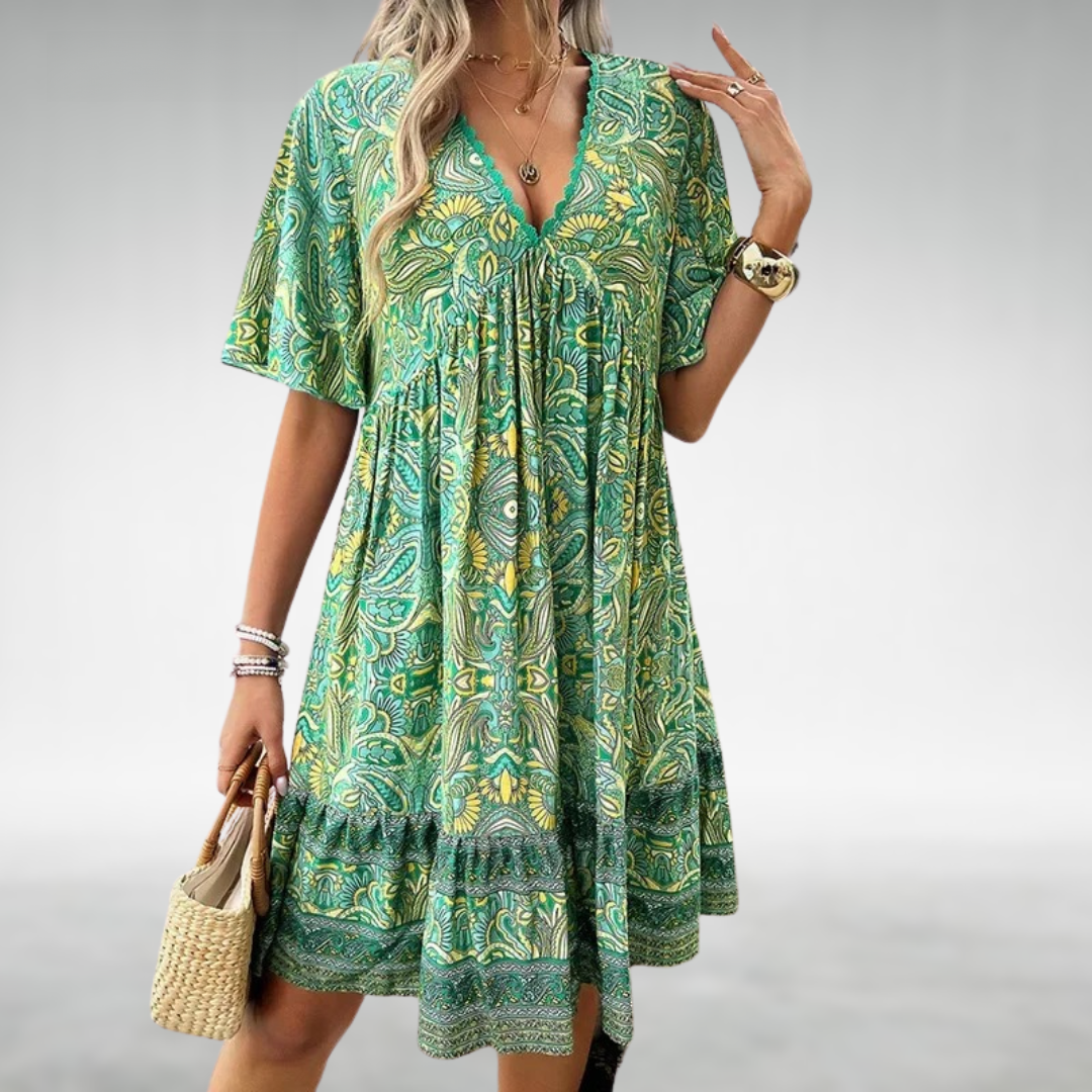Women's flowy V-neck bohemian summer dress with a vibrant print, perfect for beach vacations and casual outings.