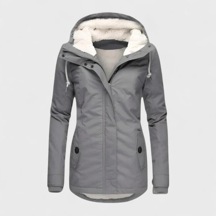 Elegant women's waterproof winter coat with hood, perfect for warmth & style in all cold weather conditions.
