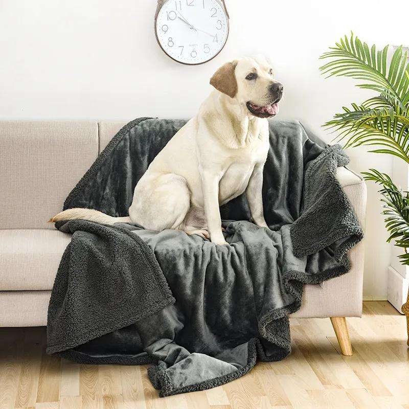 Cozy reversible waterproof pet blanket for furniture protection, perfect as a dog bed or cat mat.