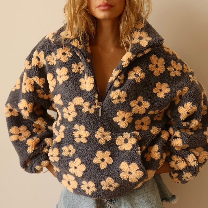 Cozy women's floral quarter zip sweater with a beautiful print. Soft, comfortable long sleeve pullover.