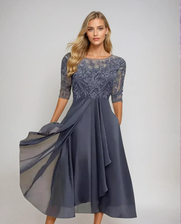 Versatile women's elegant midi dress featuring delicate floral lace & three-quarter sleeves, ideal for formal events.