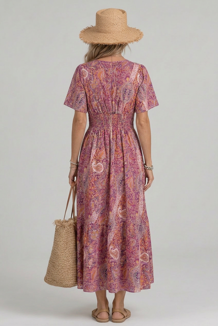 Flowy bohemian paisley V-neck maxi dress, a chic smocked summer dress for women, great for beach or casual outings.