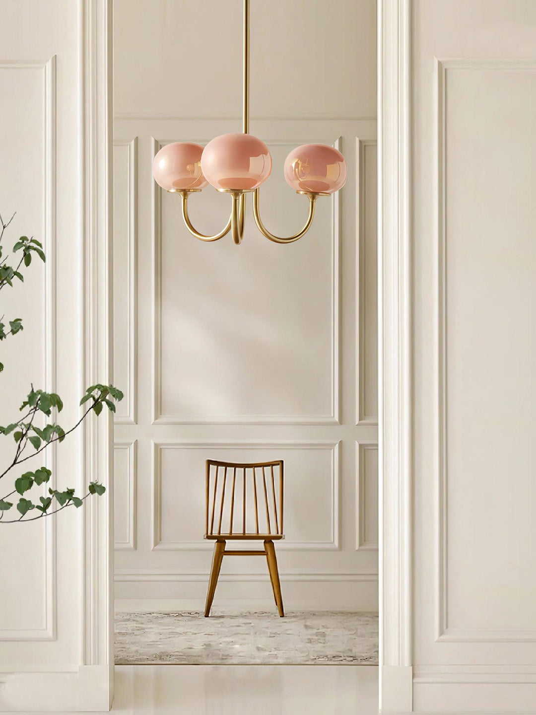 Brass glass sphere pendant, offers warm ambient light for spacious dining rooms.