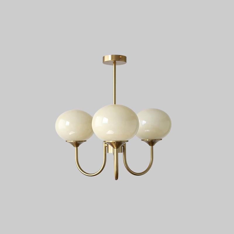 Modern brass glass sphere light, elegant ceiling lamp for peaceful bedrooms.