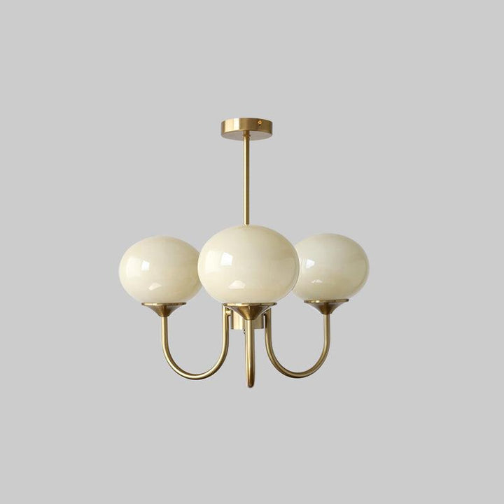 Modern brass glass sphere light, elegant ceiling lamp for peaceful bedrooms.