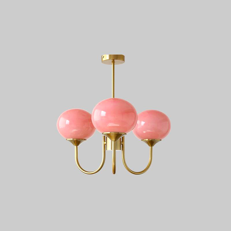 Brass glass sphere pendant, offers warm ambient light for a spacious dining room.