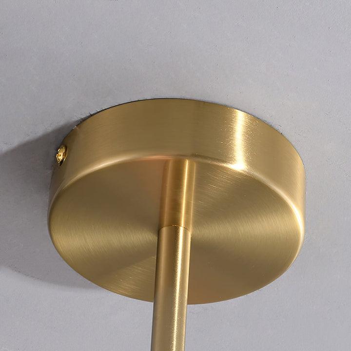 Minimalist chrome circle pendant lamp, sleek ceiling light for a tranquil bedroom.