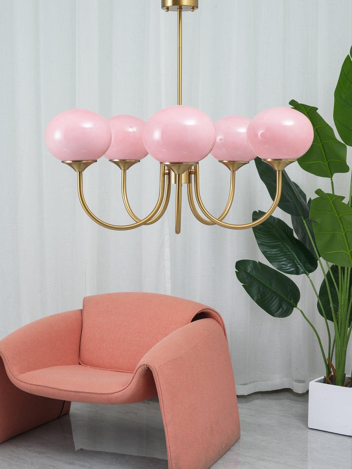 Chic brass pendant light, elegant sphere fixture for contemporary kitchen islands.