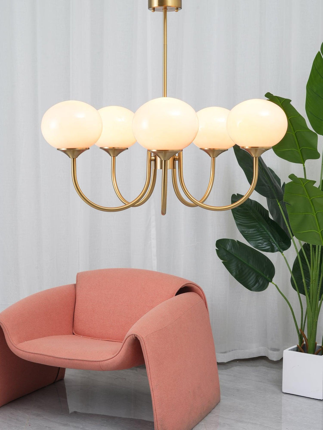 Sleek chrome glass pendant, modern lighting for bright, welcoming entryways.