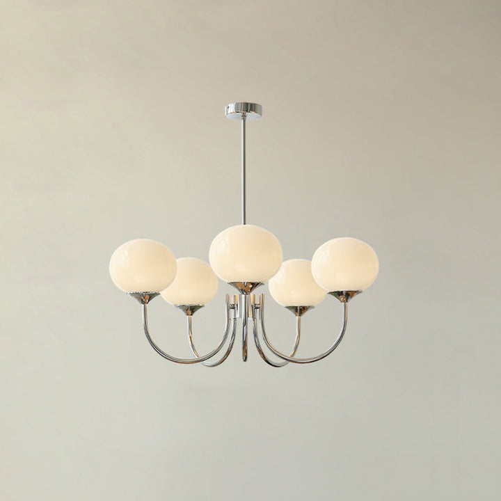 Brass sphere pendant with diffused light, modern ceiling lamp for dynamic living.