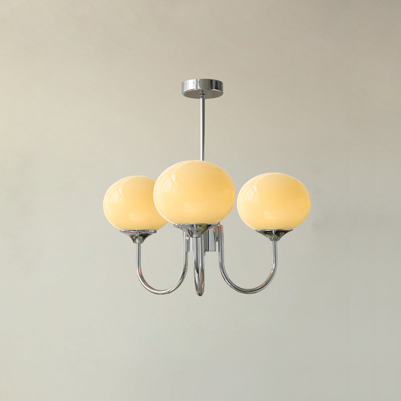 Modern brass glass sphere light, elegant ceiling lamp for a peaceful bedroom.
