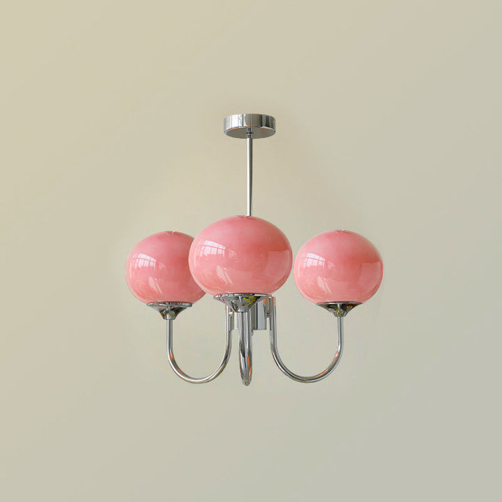 Modern chrome diffused globe lamp, provides soft light for a cozy living area.