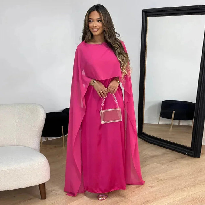 Comfortable women's flowy maxi dress with batwing sleeves. Relaxed fit, ideal for elegant casual and summer occasions.