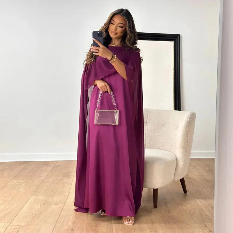 Modest women's flowy maxi dress with batwing sleeves, offering a comfortable, relaxed fit for stylish summer wear.