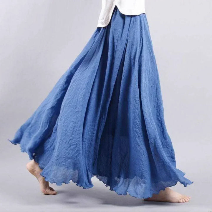 Women's flowy boho maxi skirt in soft fabric, perfect for effortless summer style & comfort.