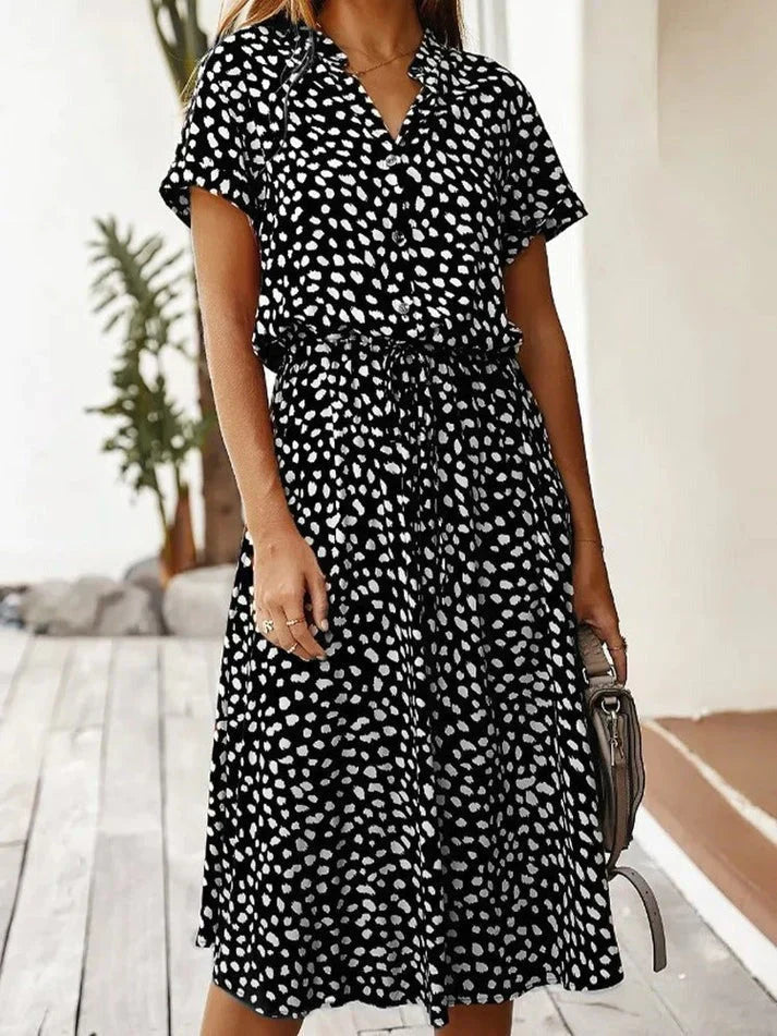 Casual women's polka dot short sleeve shirt dress, ideal for everyday spring fashion.