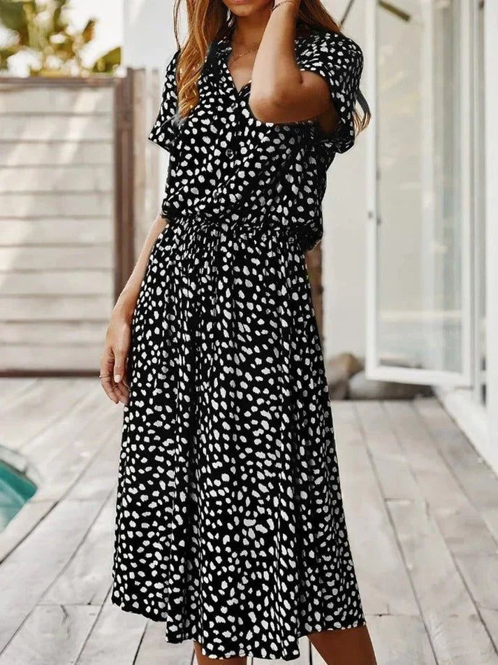 Stylish women's polka dot short sleeve summer dress with a flattering drawstring waist.