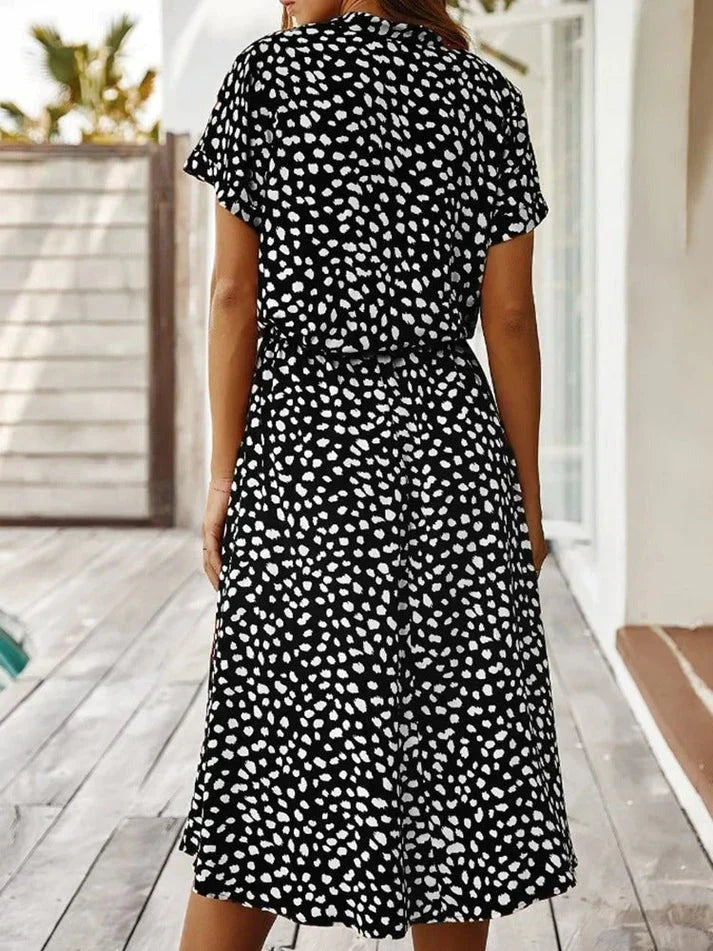 Women's short sleeve polka dot shirt dress with adjustable drawstring waist for a perfect fit.