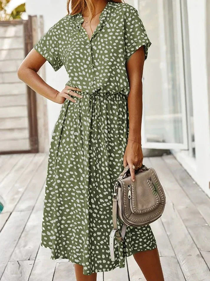 Flowy women's polka dot short sleeve shirt dress with a drawstring waist for spring/summer style.