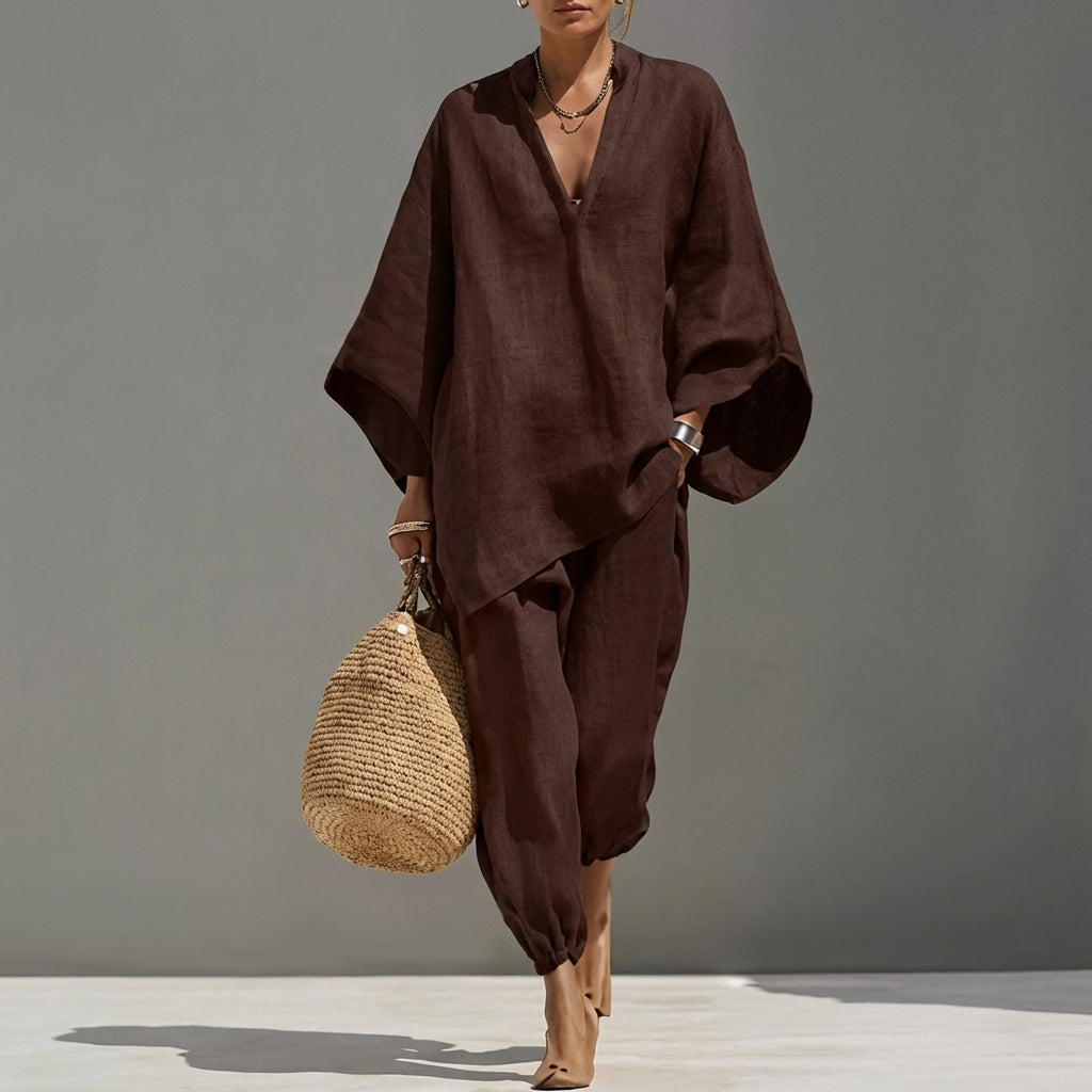 Stylish women's V-neck top & wide-leg pants two-piece set, a relaxed casual outfit for versatile wear.