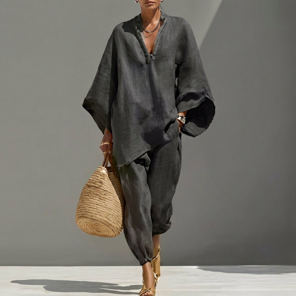 Relaxed fit women's V-neck two-piece set with wide-leg pants, a stylish & comfy casual outfit.