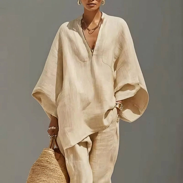 Comfy women's V-neck two-piece set featuring breathable fabric & wide-leg pants, perfect for loungewear.