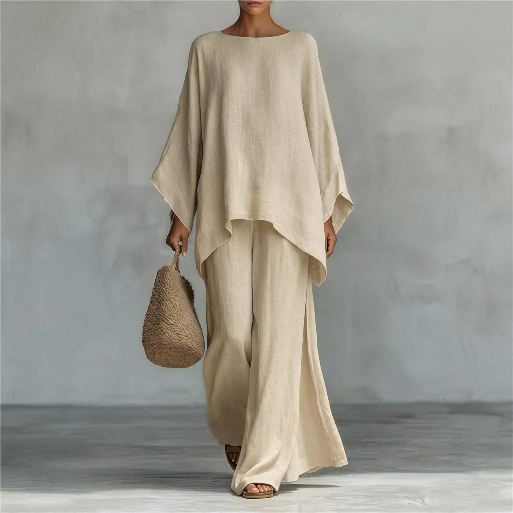 Chic women's long sleeve top and wide-leg pants coordinating set, an elegant and stylish two-piece outfit.