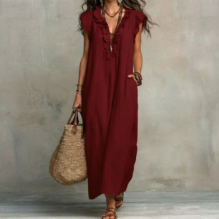 Relaxed fit elegant maxi dress for women, featuring a flattering V-neck and stylish ruffles.