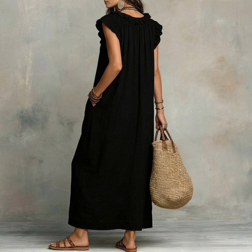Women's elegant V-neck maxi dress featuring chic ruffles and an effortless design.