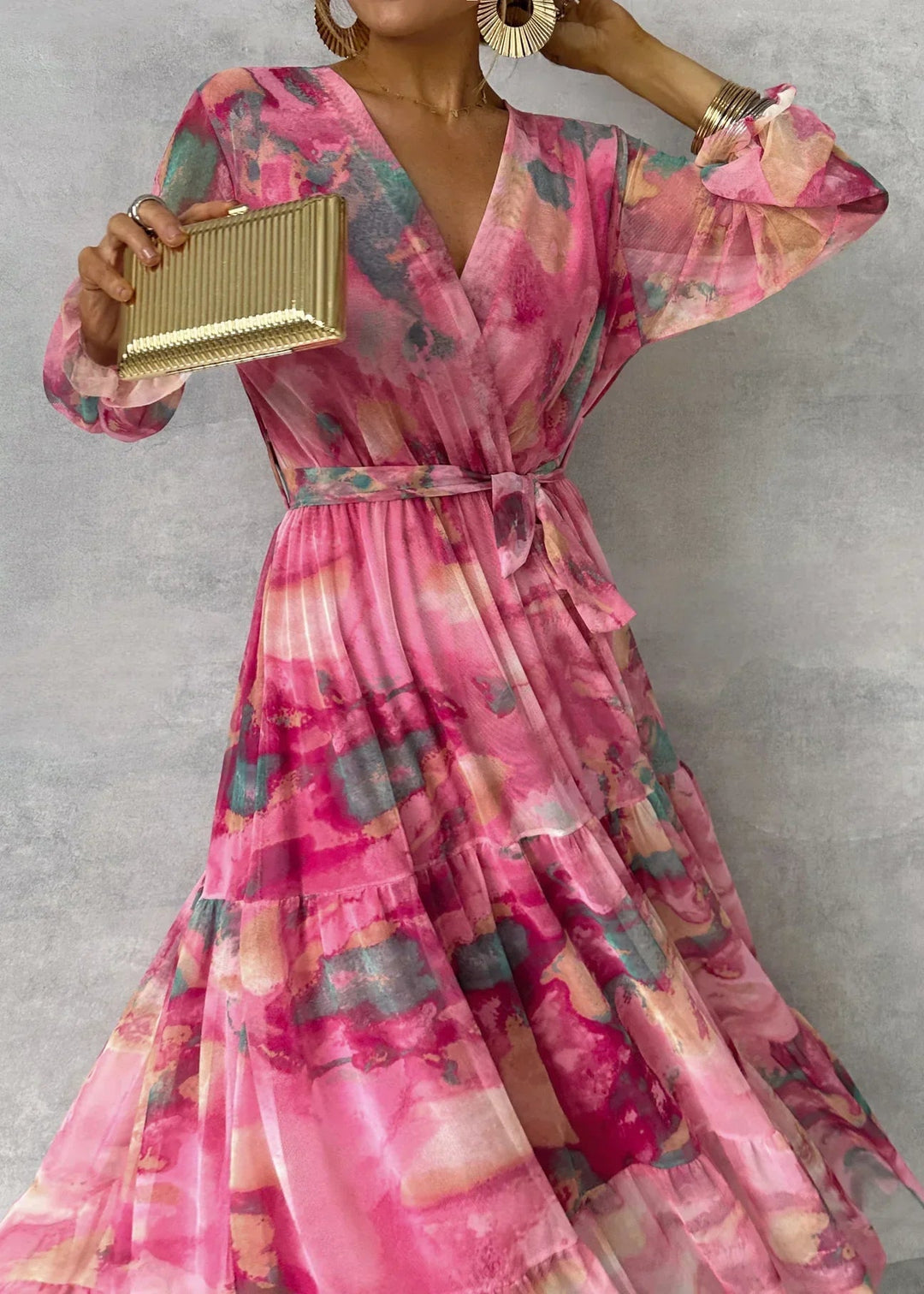 Women's graceful pink floral wrap dress, featuring a flattering silhouette for parties & special events.