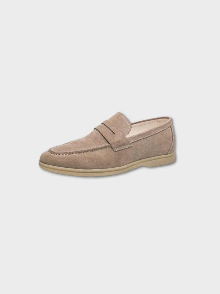 Front view: Men's vintage brown leather slip-on loafers, showcasing texture & classic style.